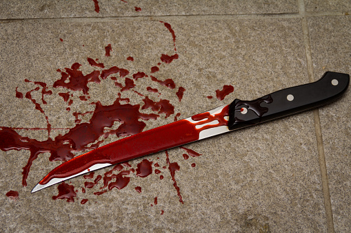 bloody knife on ground